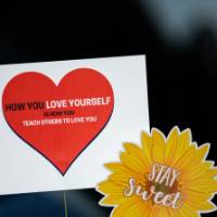 Girls of Color Summit previous event with signs that say Stay Sweet and How You Love Yourself